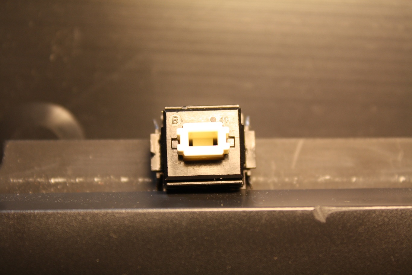 NeXT Non-ADB - AAE Alps key switch markings "B" and "4C". Zooming in on high-rez original, the dot to the left of the "4C" is nothing.