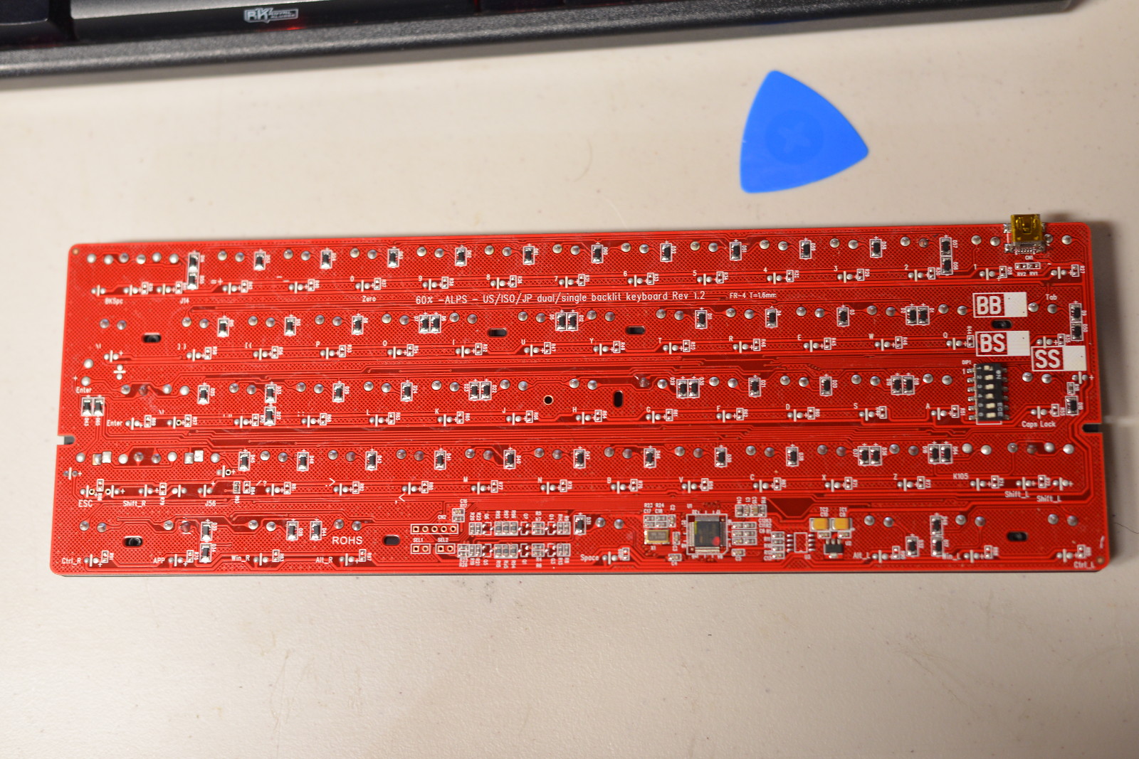 Back side of V60 PCB. Diodes and unknown controller visible.