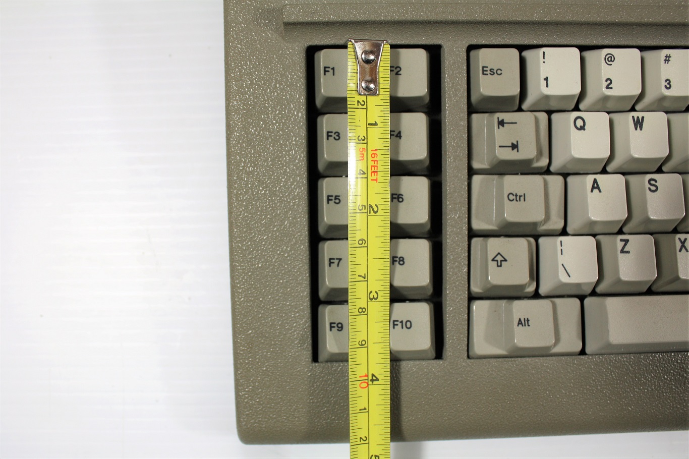 Measurements of the Industrial XT opening is about 3.75 inches or about 9.5 cm and makes the bottom row bind.