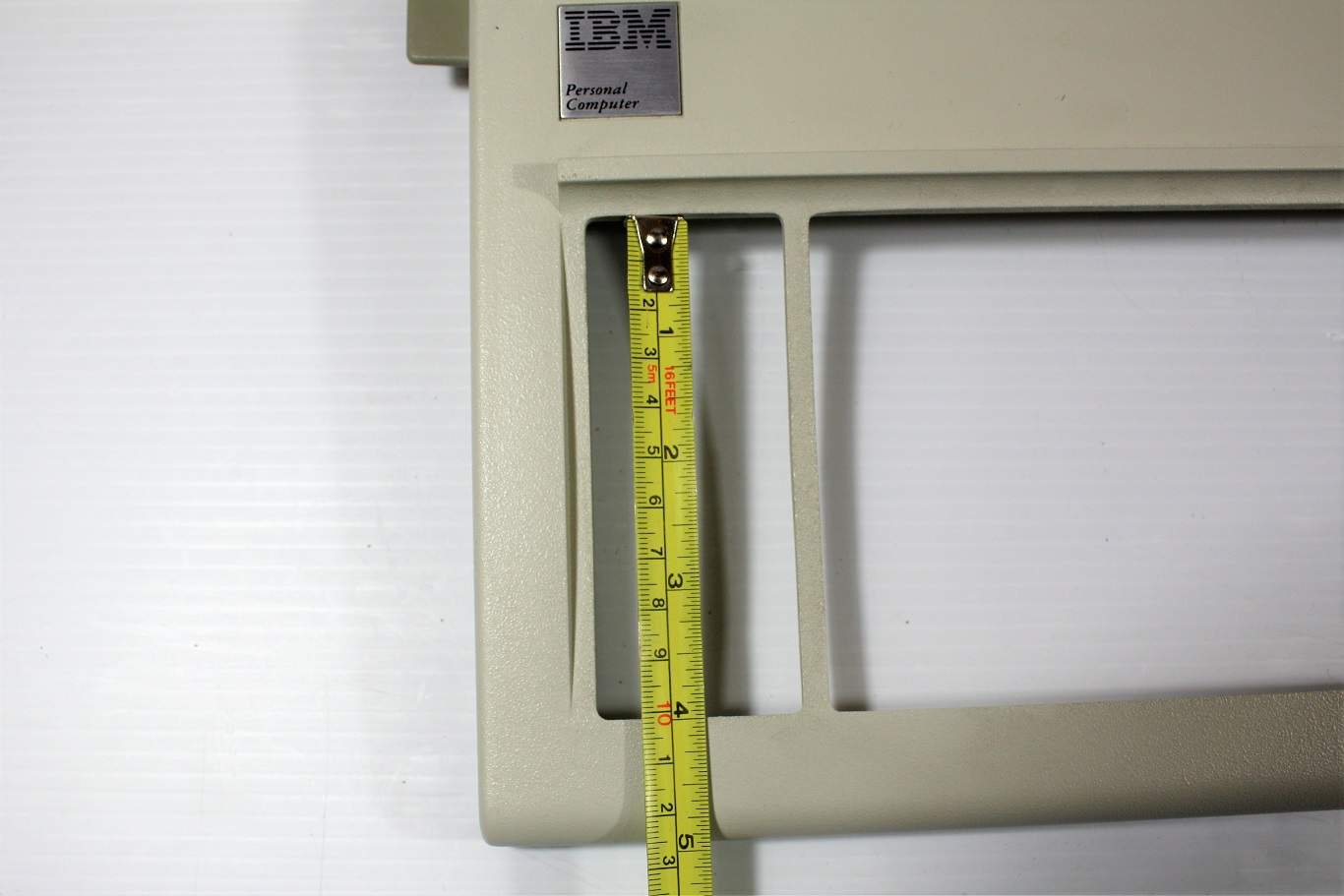 Measurements of the normal XT opening is about 4 inches or about 10 cm and allows the Model F keys to move freely.
