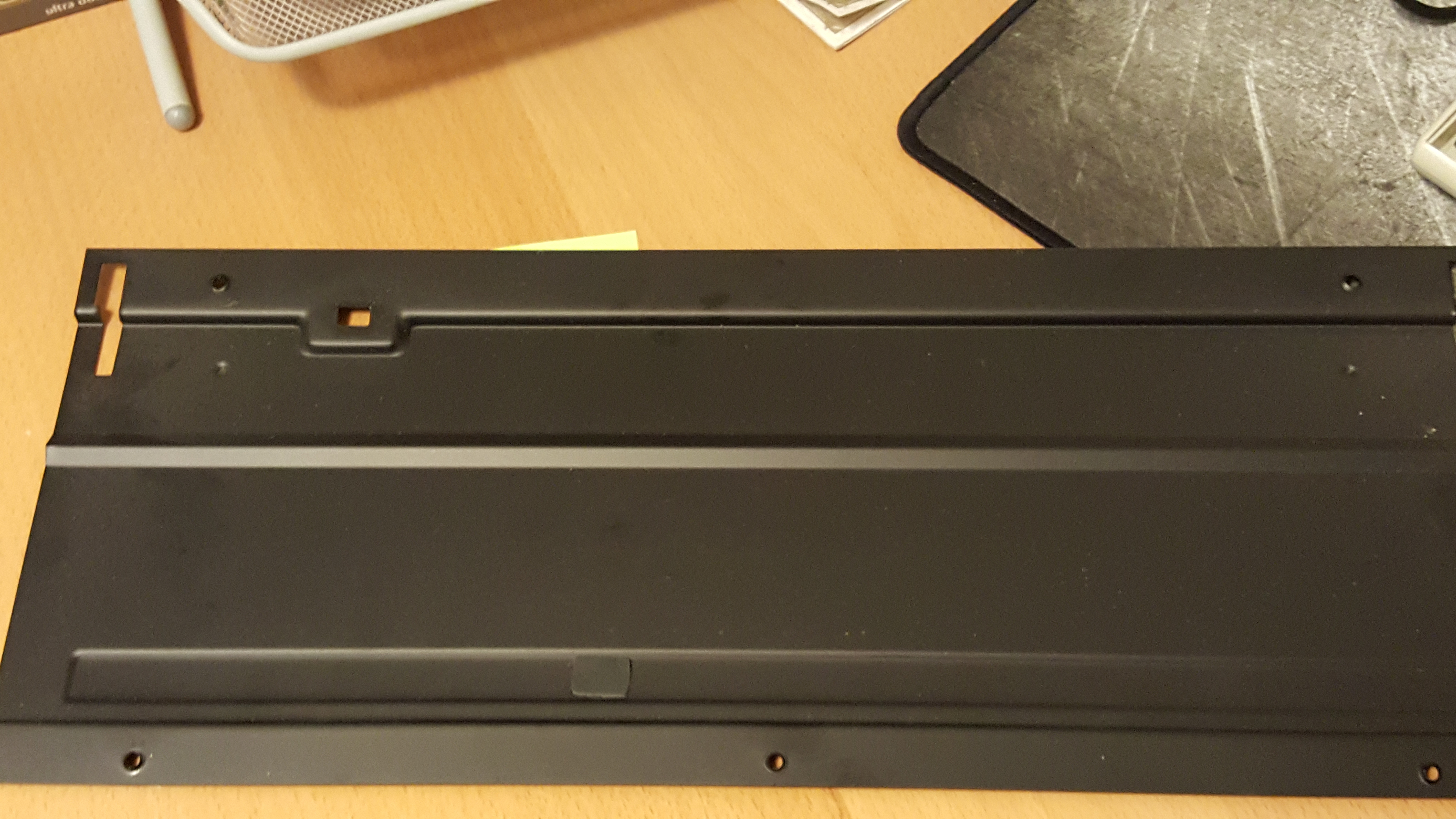There's you are! The missing rubber pad ended up on the inside of the case plate. No idea who put it there :S