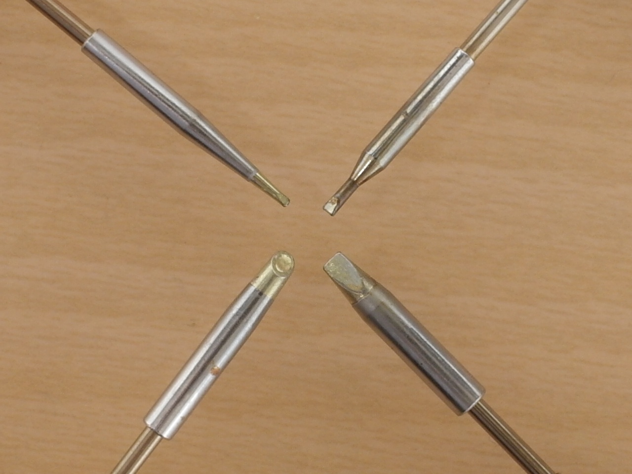 Weller soldering tips close-up, 0.8x0.4mm, 1.2x0.4mm, 2.0x0.4mm, and a &quot;gull wing&quot; tip for drag soldering.