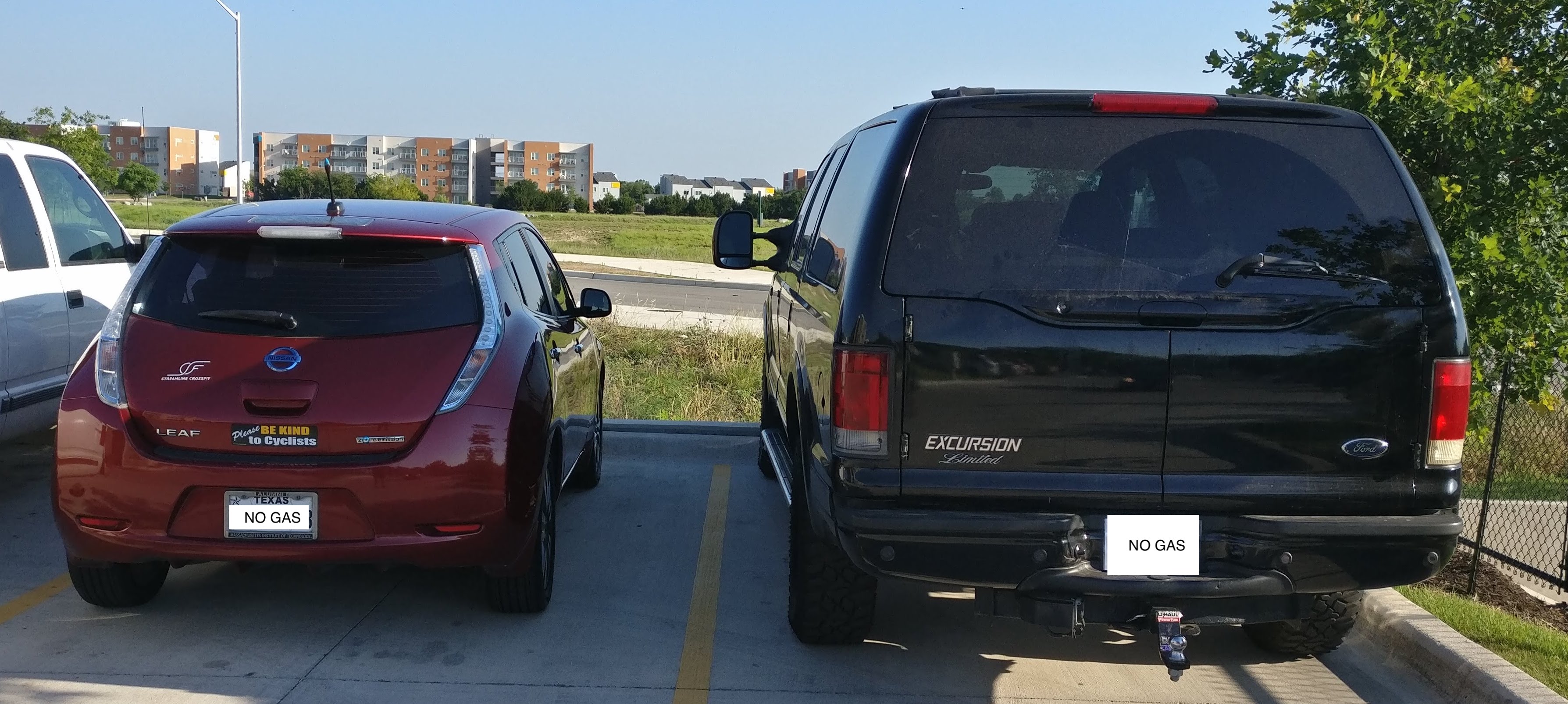 Hard to imagine two more different vehicles: electric Leaf and diesel Excursion.