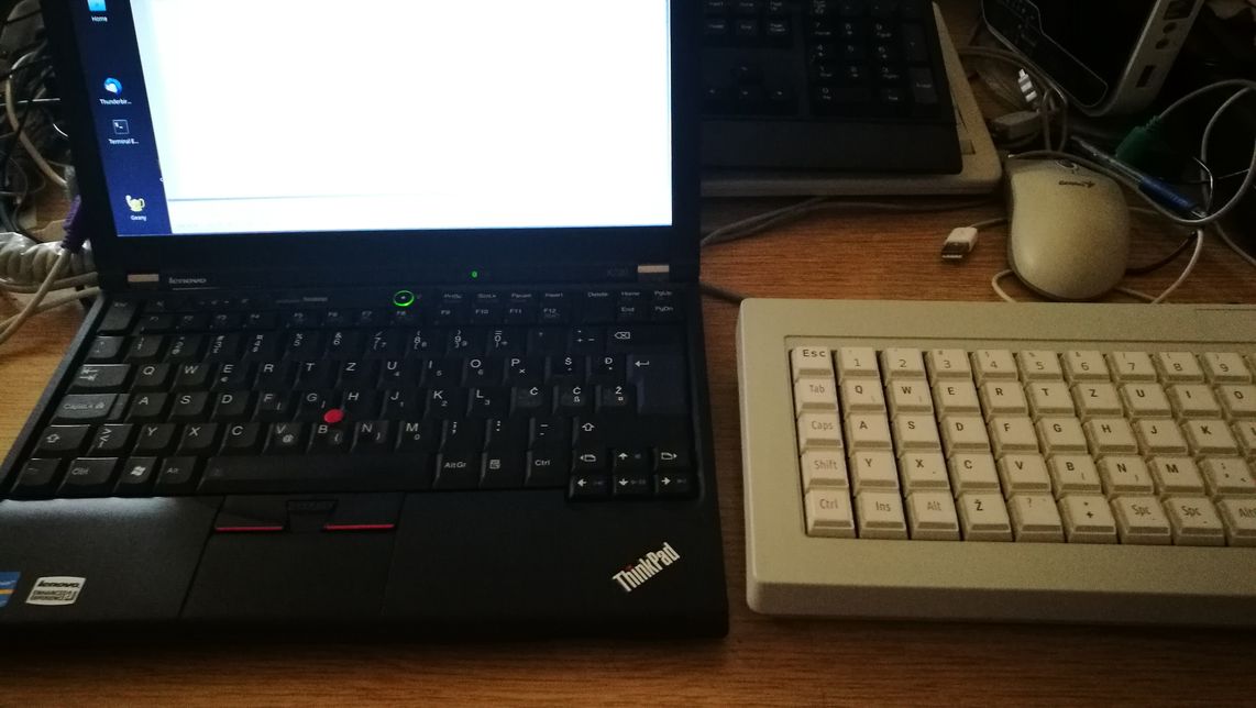 Works just fine with my Thinkpad - connected to USB via 2 adapters