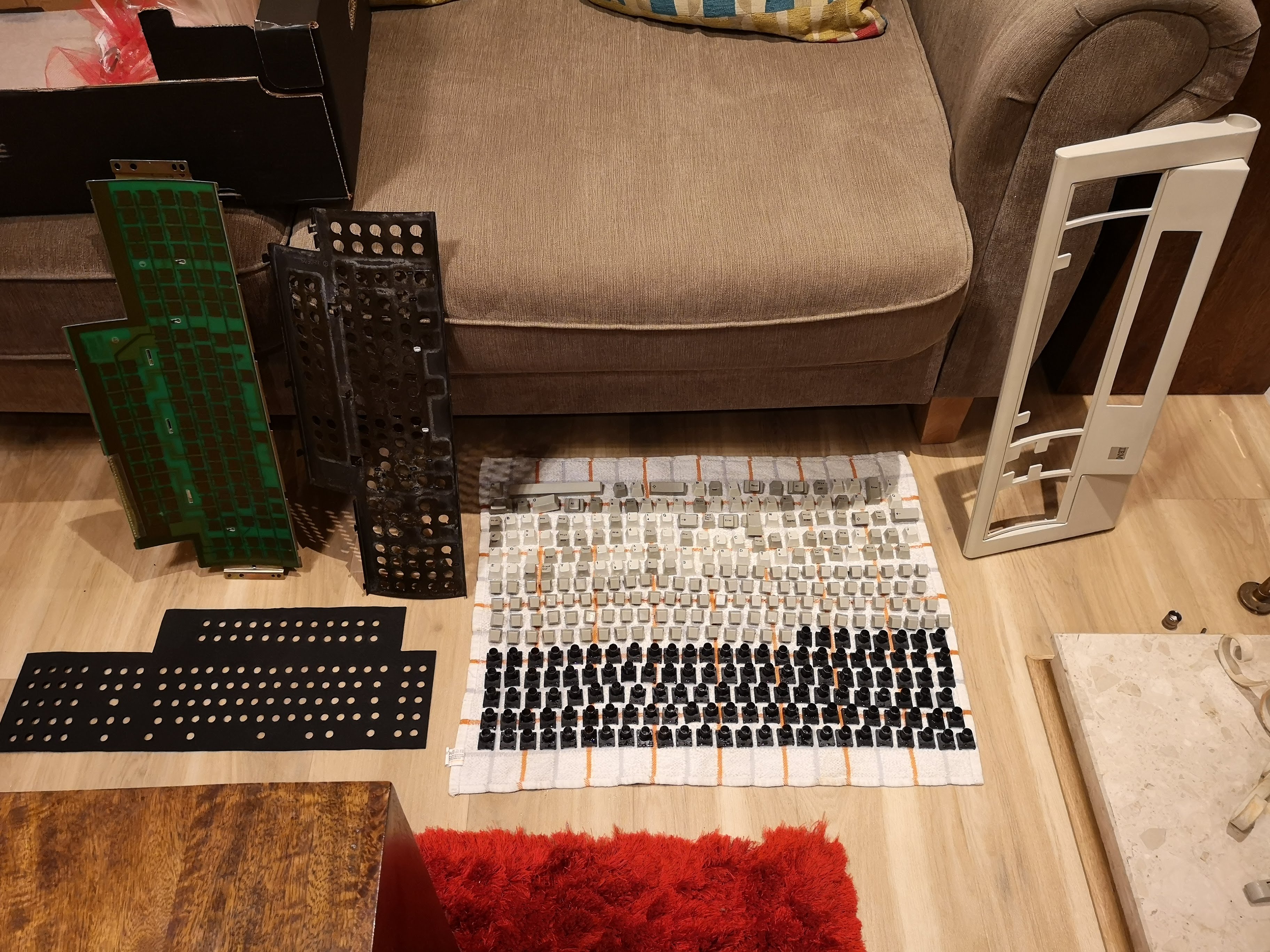 top case key stems, key barrels, keycaps all drying and new 3mm neoprene foam cut.jpg