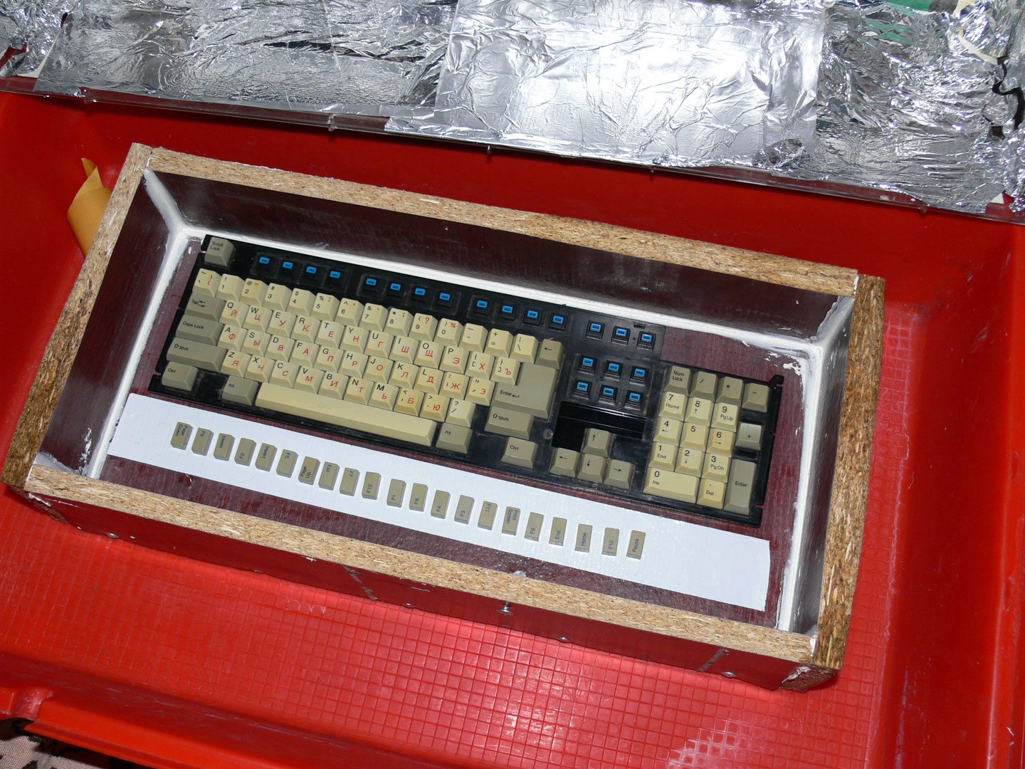 Key caps in tray ready for retrobright