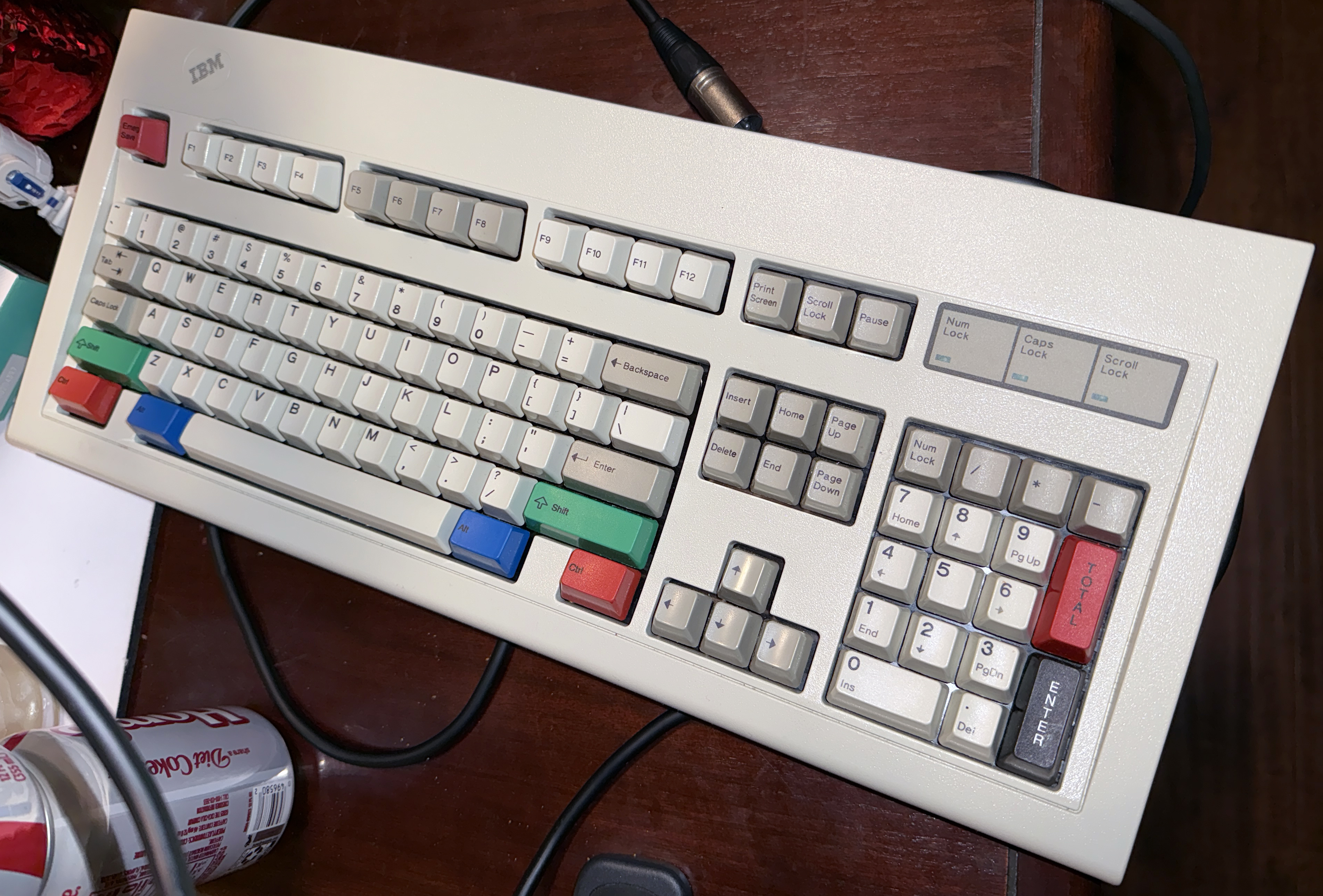 I found this May 4, 1987, model M in its original box, plastic, styrofoam, and accessories (like an odd heavy black, uncoiled, AC power cord). It has a shiny iridescent steel backplate, and is the second-heaviest model M in my collection. I added Unicomp and other aftermarket keycaps to spruce it up.<br /><br />.